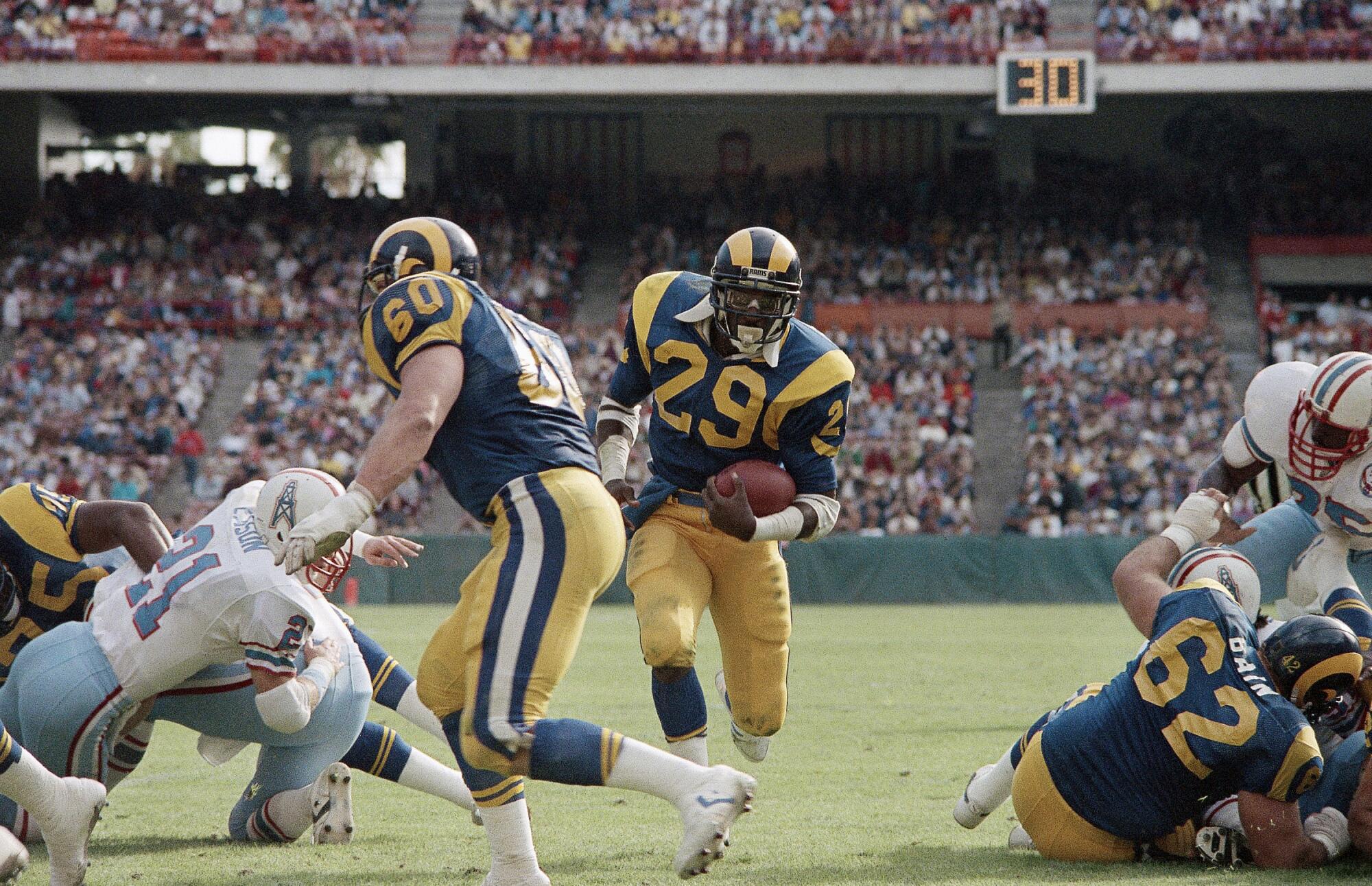 Rams running back Eric Dickerson carries the ball against the Houston Oilers in December 1984.