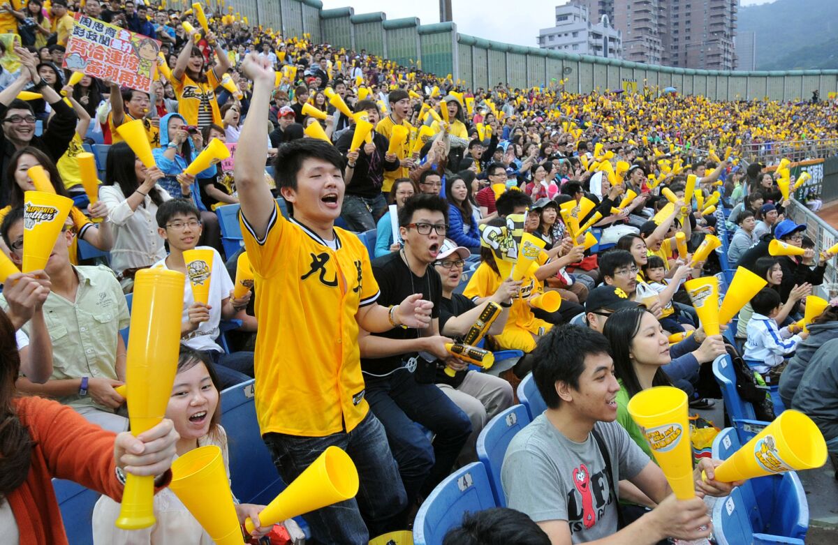 More than 10,000 Taiwanese fans pack Tianmu baseball stadium for a game between the Uni-President Lions and the Brother Elephants in Taipei on March 24, 2013.