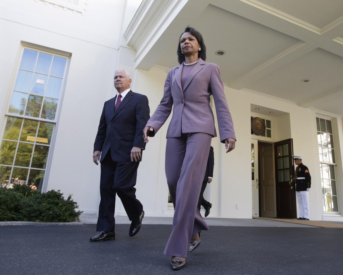 Robert Gates and Condoleezza Rice