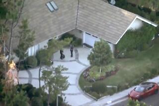 Police at the home of Samuel Haskell in the 4100 block of Coldstream Terrace in Tarzana. 