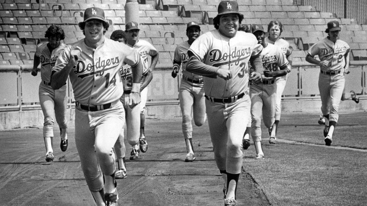 Dodger pitcher Fernando Valenzuela races with Mike Scioscia in their first full workout since the strike on Aug. 1, 1981.