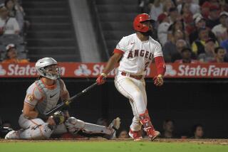 Los Angeles Angels' Luis Rengifo, right, heads to first for a two-run home run as Baltimore Orioles catcher James McCann watches during the third inning of a baseball game Wednesday, Sept. 6, 2023, in Anaheim, Calif. (AP Photo/Mark J. Terrill)
