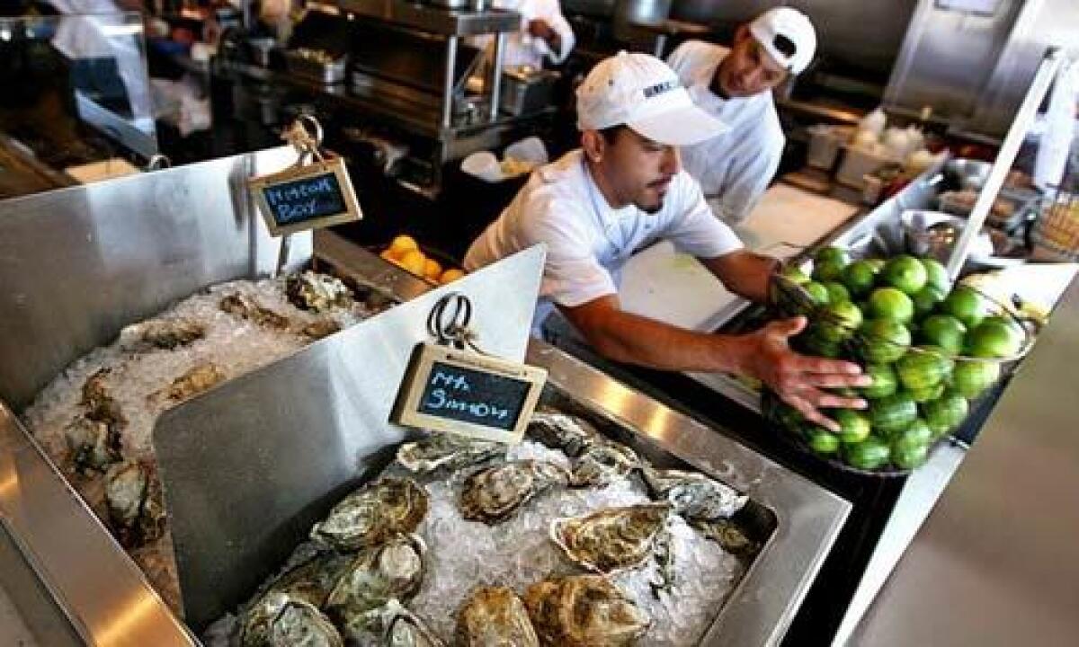 Oysters are displayed by the open kitchen at Blue Plate Oysterette in Santa Monica.