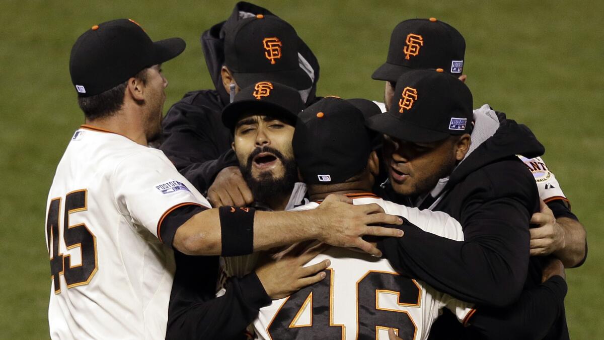 San Francisco Giants players celebrate their National League division series-clinching victory over the Washington Nationals in Game 4 on Tuesday.