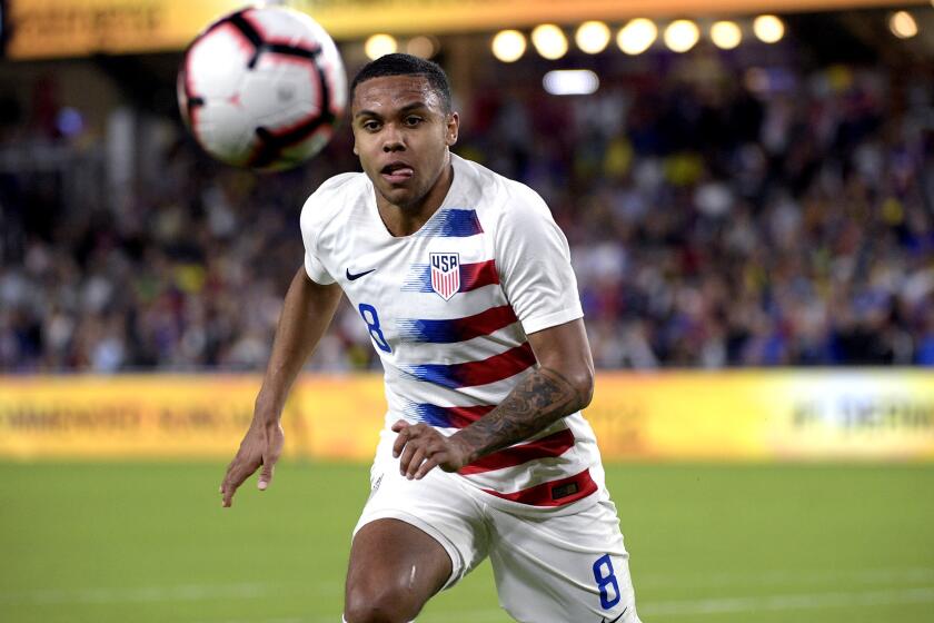 United States midfielder Weston McKennie (8) chases down a ball during the first half of an international friendly soccer match against Ecuador Thursday, March 21, 2019, in Orlando, Fla. (AP Photo/Phelan M. Ebenhack)