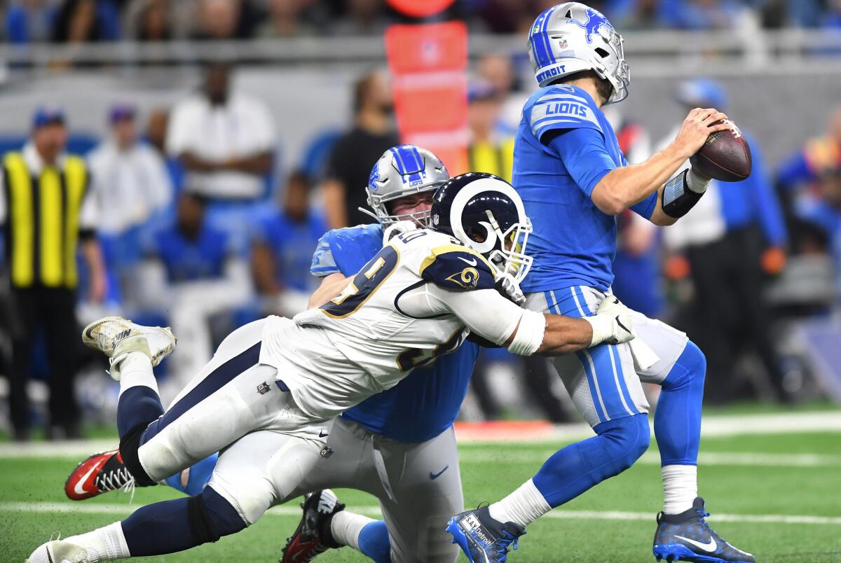 Rams defensive tackle Aaron Donald sacks Detroit Lions quarterback Matthew Stafford at Ford Field in Detroit on Sunday.