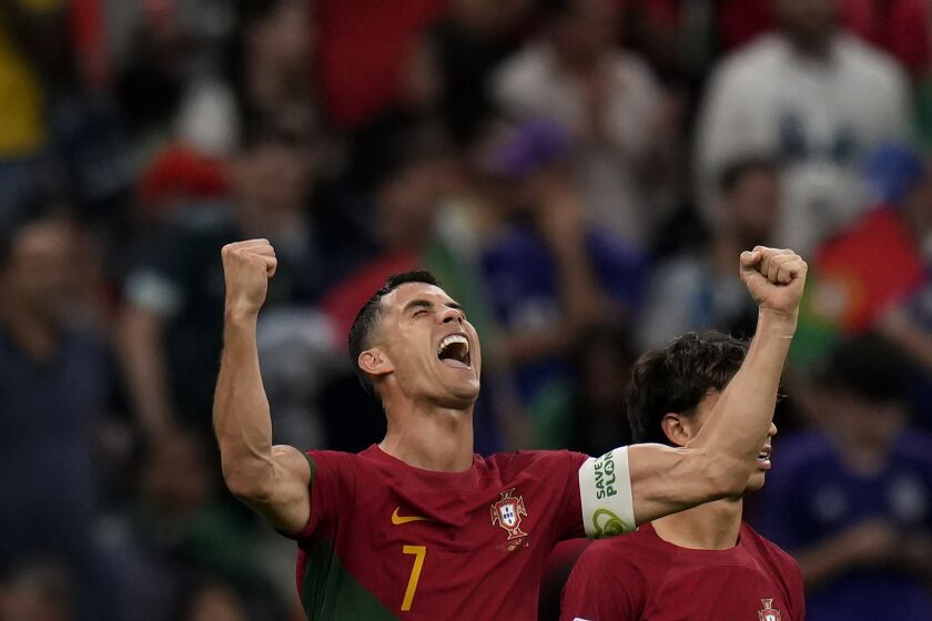 Portugal's Cristiano Ronaldo celebrates after scoring his side's opening goal during the World Cup group H soccer match between Portugal and Uruguay, at the Lusail Stadium in Lusail, Qatar, Monday, Nov. 28, 2022. (AP Photo/Aijaz Rahi)
