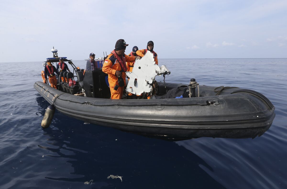 Rescuers recover a piece of an aircraft during a rescue operation in the Java Sea on Oct. 29, 2018.  Lion Air flight 610 crashed into the sea just 13 minutes after its takeoff.