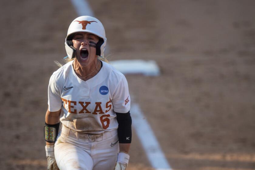 Texas' Bella Dayton celebrates after a home run against Texas A&M in Game 2 of the NCAA college Division I softball tournament super regional in Austin, Texas, Saturday May 25, 2024. (Meredith Seaver/College Station Eagle via AP)