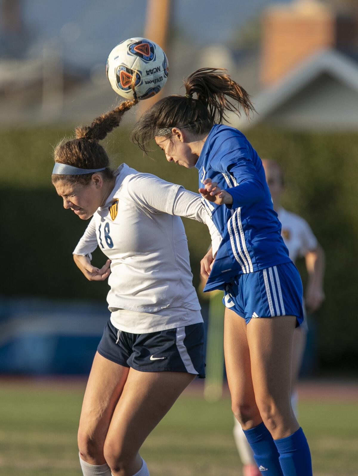 Marina's Abby Kirby goes up for a header against Bishop Amat's Jasmine Delgado on Friday.