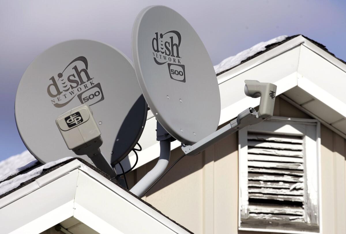 In this November 2008 photo, Dish Network satellite dishes are attached to a home in Buffalo, N.Y. A federal judge ruled in January that the service's automatic TV recording, remote streaming and commercial skipping features did not violate Fox Broadcasting's copyrights, although some of the features did violate Dish's contracts with Fox.