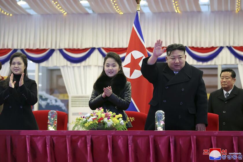 FILE - In this photo provided by the North Korean government, North Korean leader Kim Jong Un, second right, with his daughter and his wife Ri Sol Ju, left, attends a performance to celebrate the New Year in Pyongyang, North Korea, Sunday, Dec. 31, 2023. Independent journalists were not given access to cover the event depicted in this image distributed by the North Korean government. The content of this image is as provided and cannot be independently verified. Korean language watermark on image as provided by source reads: "KCNA" which is the abbreviation for Korean Central News Agency. (Korean Central News Agency/Korea News Service via AP, File)