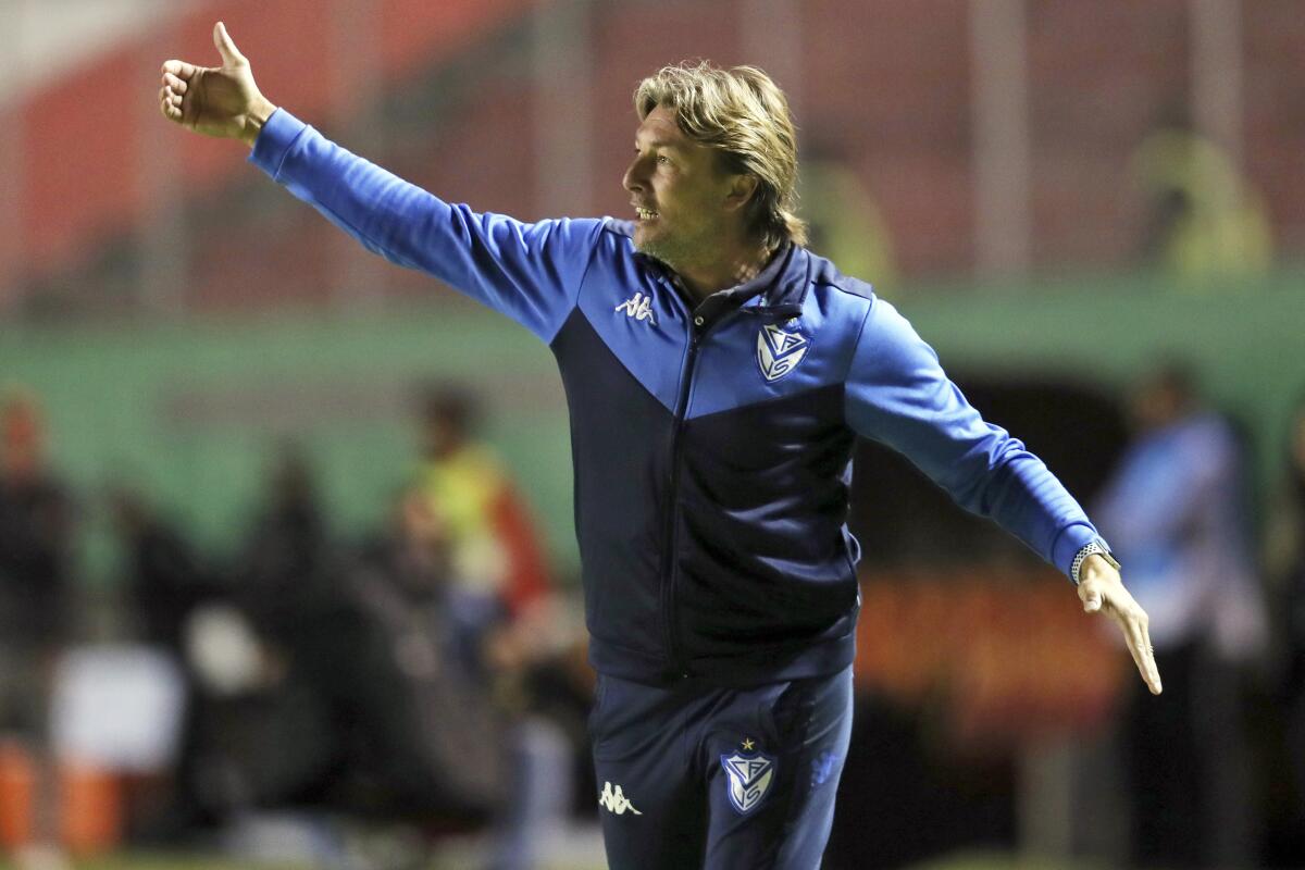 FILE - In this Feb. 18, 2020, file photo, Velez Sarsfield coach Gabriel Heinze directs his players during a Copa Sudamericana soccer match against Aucas at the Gonzalo Pozo Ripalda stadium in Quito, Ecuador. Hoping to recreate the success of its first coach, Atlanta United hired Argentina's Gabriel Heinze on Friday, Dec. 18, 2020, to manage the Five Stripes, who endured a miserable season just two years after winning the MLS Cup championship. (AP Photo/Dolores Ochoa, File)