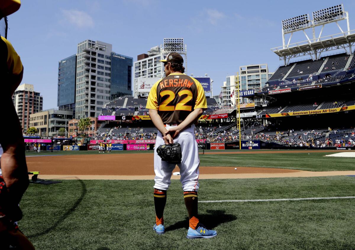 Dodgers pitcher Clayton Kershaw, who is on the disabled list, watches batting practice before the All-Star home run derby in San Diego.