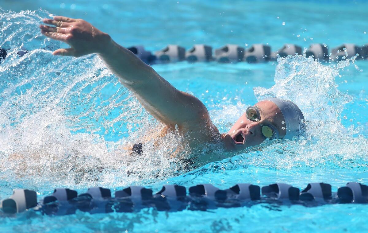 Newport Harbor High's Ayla Spitz wins the girls' 200-yard free in the Surf League meet against Los Alamitos on April 18.