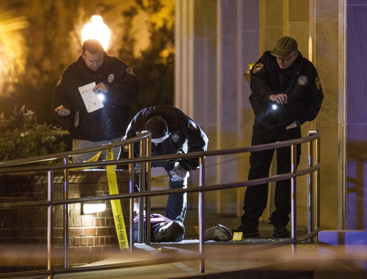 Tallahassee police investigate the scene of a shooting outside the Strozier Library on the Florida State University campus.