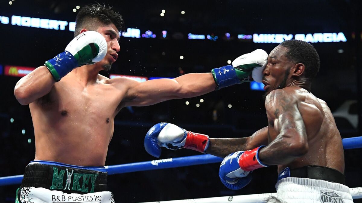 Mikey Garcia (left) defeats Robert Easter Jr. (right) in their WBC and IBF World Lightweight Title fight.