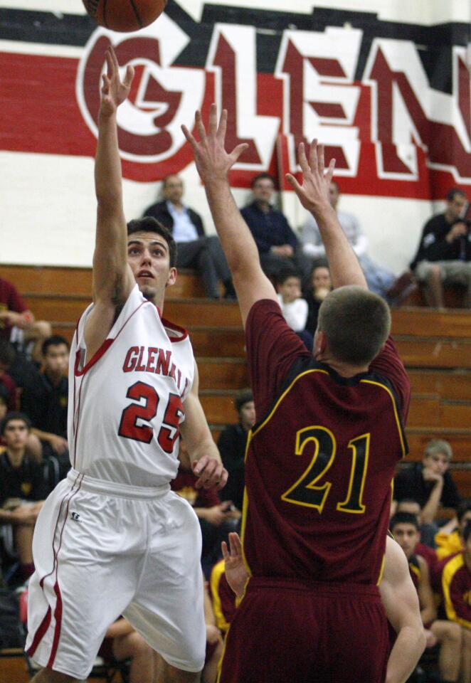 Glendale's Arada Zakarian, left, goes for a layup during a game against Arcadia at Glendale High School on Wednesday, January 9, 2013.