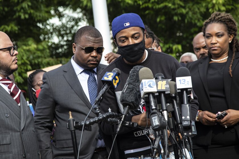 Andrew Brown Jr's son Jha'Rod Ferebee speaks during during a press conference outside the Pasqoutank County Public Safety building in Elizabeth City, N.C., Tuesday, May 11, 2021, after family of Andrew Brown Jr. viewed about 20 minutes of video from the police shooting death of Brown in April. Family attorneys said the longer, redacted video showed Brown did nothing to threaten or provoke deputies and his hands were visible when they approached his car. (Travis Long/The News & Observer via AP)