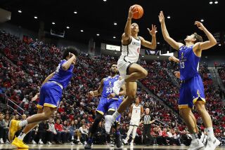 San Diego, CA - January 28: San Diego State's Keshad Johnson scores on a revers against San Jose State on Saturday, January 28, 2023 in San Diego, CA. (K.C. Alfred / The San Diego Union-Tribune)