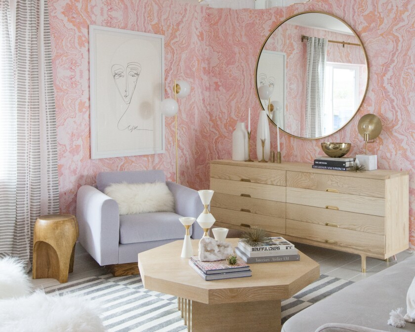 Pink agate wallpaper designed by Sarah Sherman Samuel lines the walls in a Palm Springs guest bedroom. 