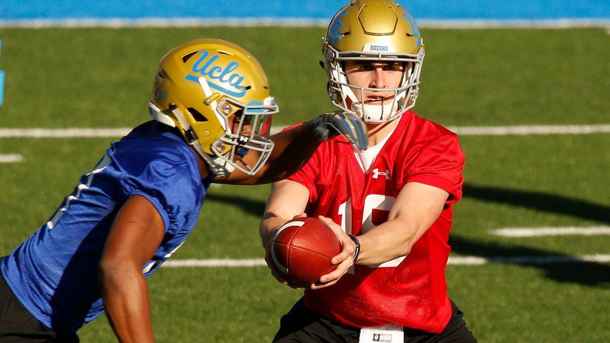 UCLA quarterback Matt Lynch (15) prepares to hand off the ball during spring practice at Spaulding Field.