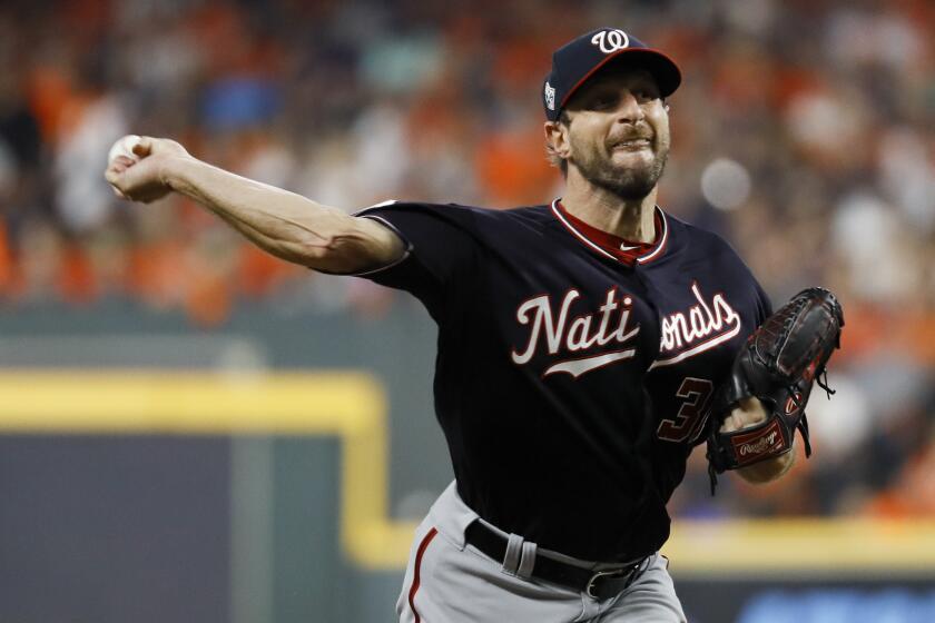 Washington Nationals starting pitcher Max Scherzer throws against the Houston Astros during the first inning of Game 1 of the baseball World Series Tuesday, Oct. 22, 2019, in Houston. (AP Photo/Matt Slocum)