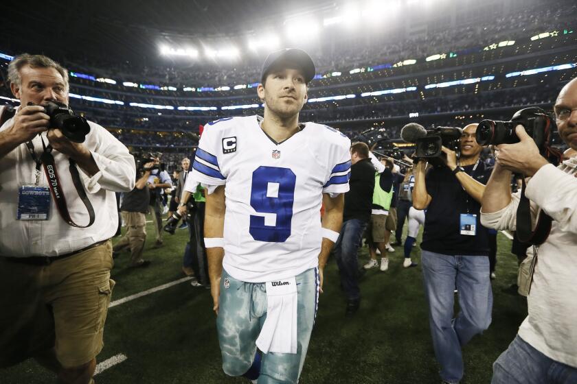 Cowboys quarterback Tony Romo leaves the field after the second half of an NFL football game against the Colts.