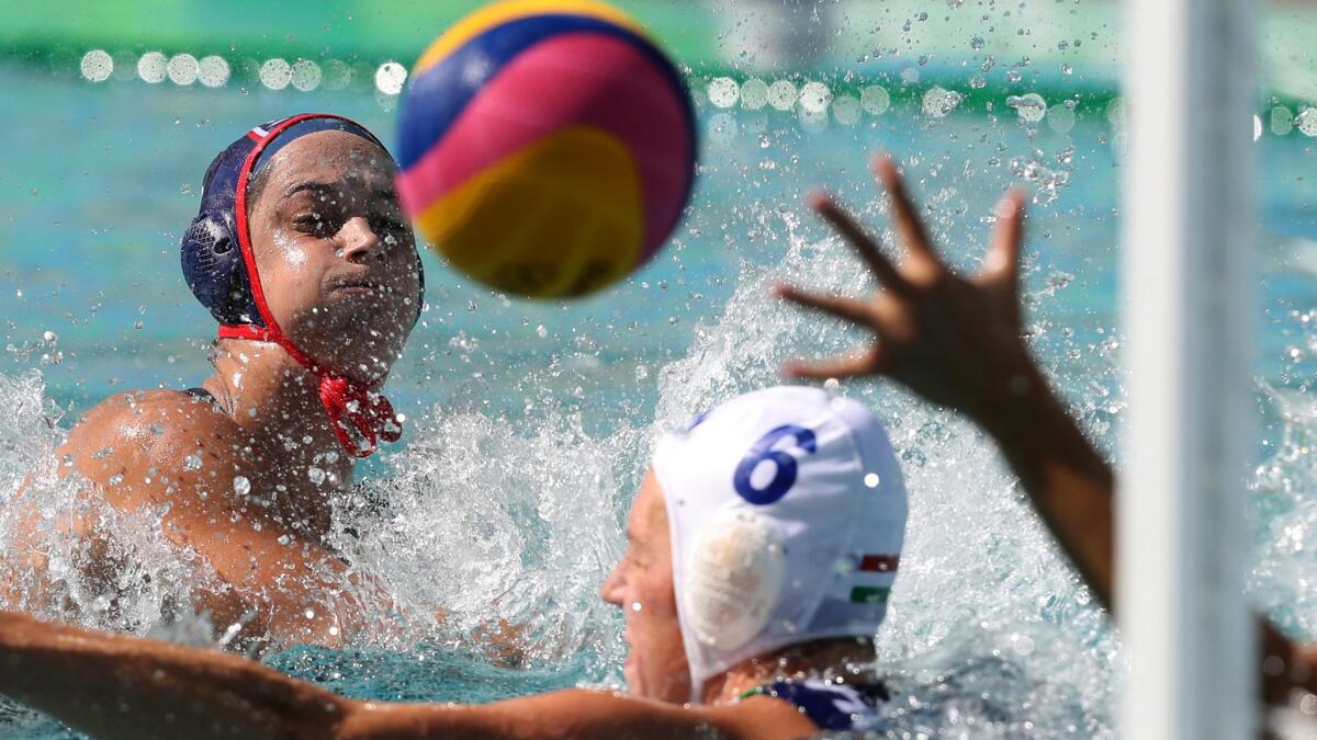 U.S. team captain Maggie Steffens takes a shot against Hungary during a women's water polo preliminary round game Saturday.