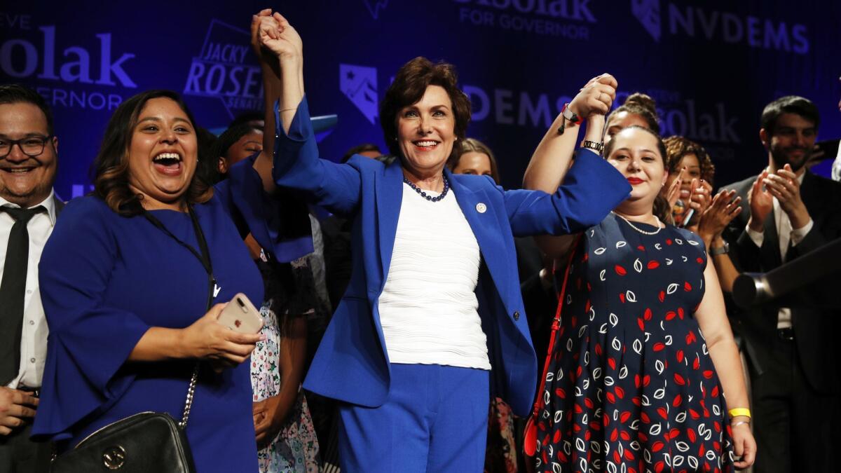 Rep. Jacky Rosen (D-Nev.), center, celebrates after defeating Republican Sen. Dean Heller.