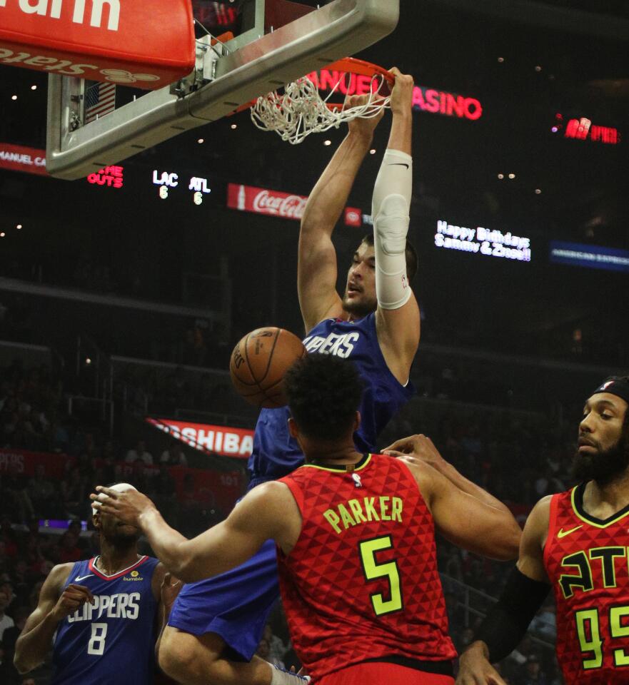 Clippers center Ivica Zubac dunks our Atlanta Hawks forward Jabari Parker.