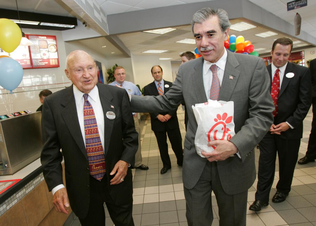 Chick-fil-A founder S. Truett Cathy, left, and former U.S. Secretary of Commerce Carlos Gutierrez on July 25, 2006.