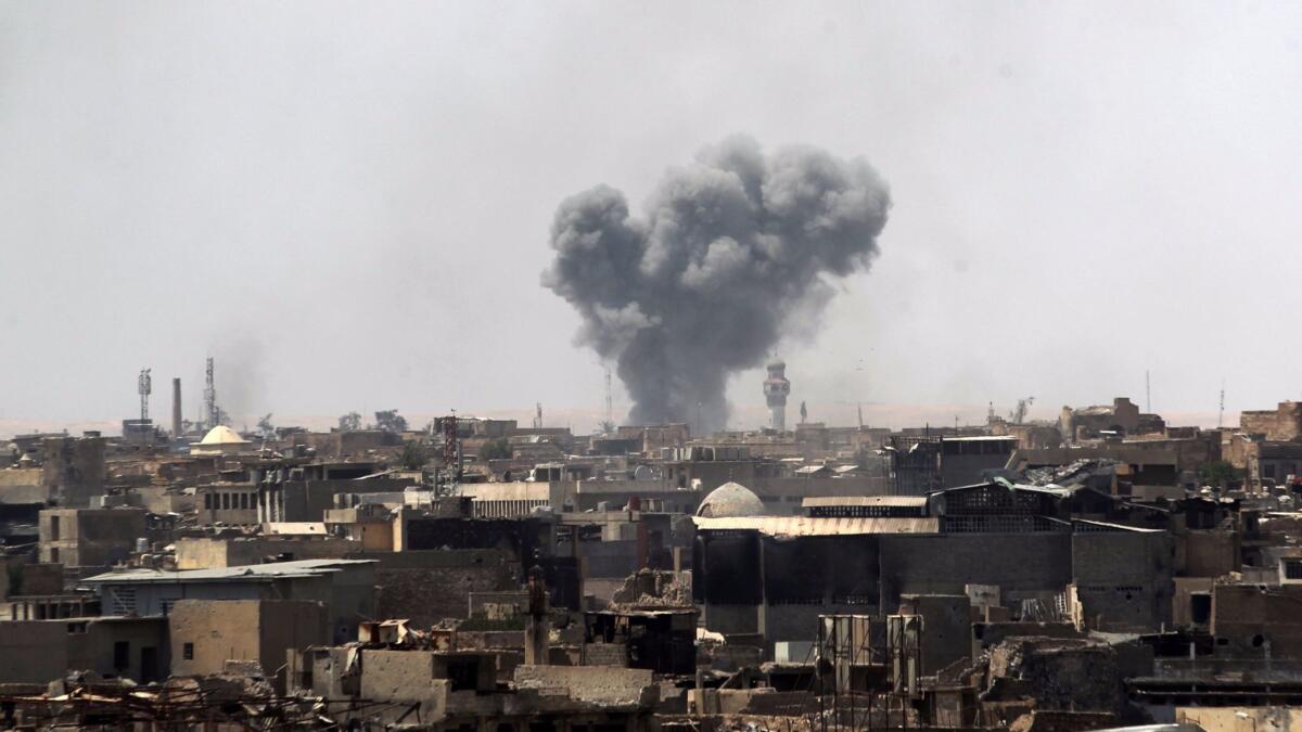 Smoke billows from Mosul's Old City on June 18, 2017, during the offensive by Iraqi forces to retake the last district still held by Islamic State.