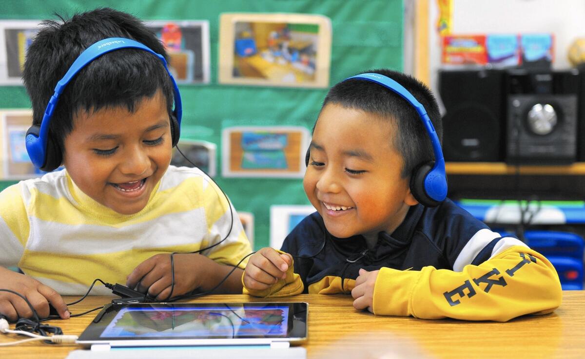 The Los Angeles Unified School District may cut up to 4,000 preschool slots. Above, preschool students Angel Chinol Gonzalez, left, and Alexander Manuel Cano, right, at Esperanza Elementary School in Los Angeles on April 20.