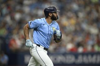 Tampa Bay Rays' Amed Rosario runs after hitting a pitch