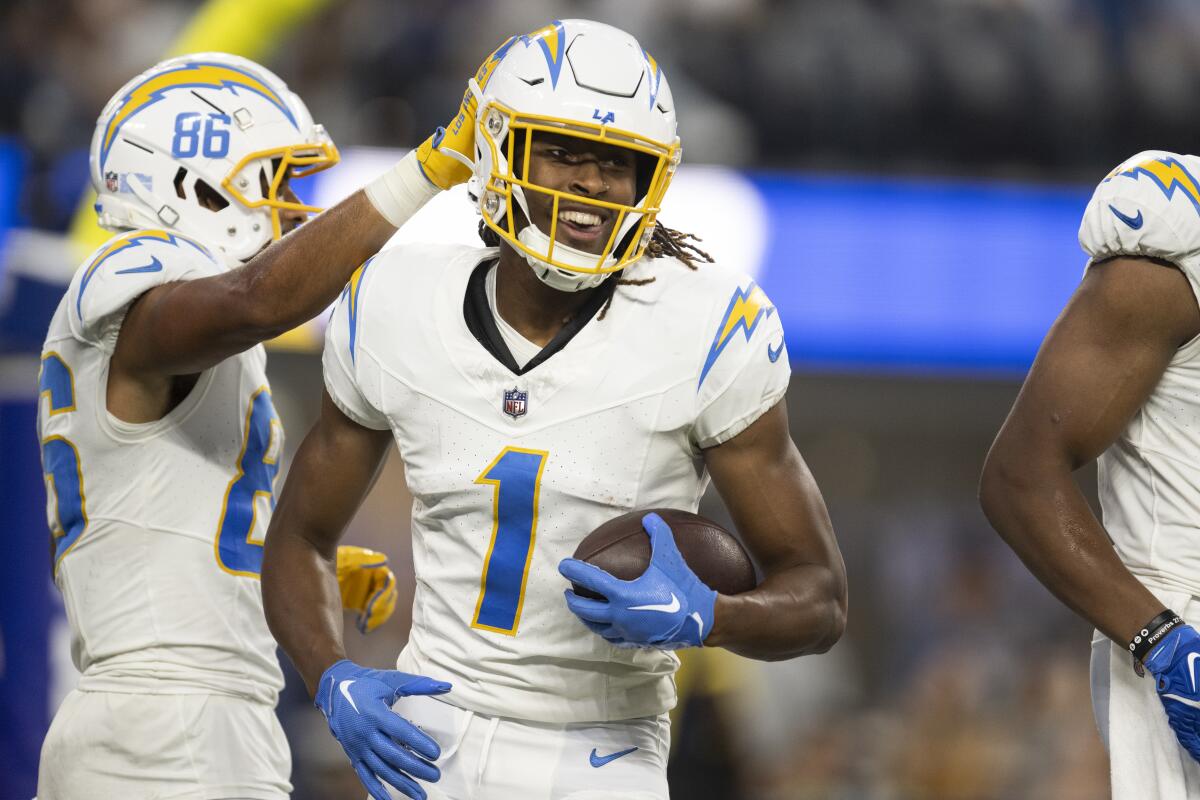 Chargers wide receiver Quentin Johnston smiles after scoring a touchdown against the Rams on Aug. 12.