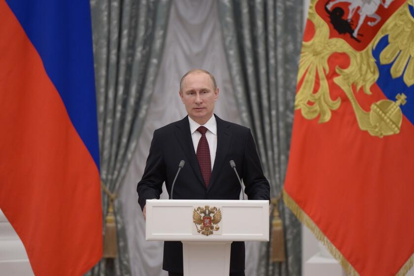 Russian President Vladimir Putin speaks during an awarding ceremony in Moscow's Kremlin.