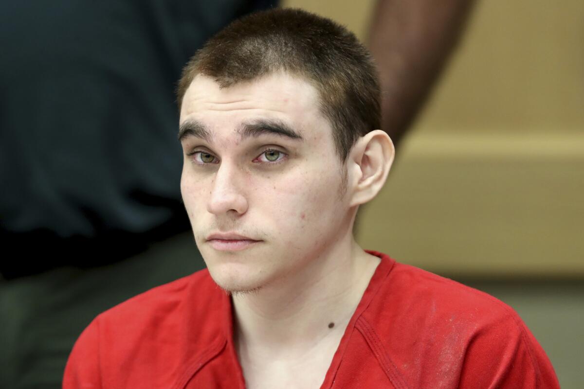 FILE - In this Dec. 10, 2019 Nikolas Cruz appears at a hearing in Fort Lauderdale Fla. A judge says Cruz, accused of murdering 17 people at a Florida high school cannot be called derogatory terms like “animal” or “that thing” during his upcoming trial. Circuit Judge Elizabeth Scherer in a ruling released Friday, Sept. 3, 2021 said it would be impossible to create a complete list of words prosecutors and witnesses can’t use at Nikolas Cruz’s upcoming trial for the 2018 killings at Marjory Stoneman Douglas High in Parkland. (Amy Beth Bennett/South Florida Sun-Sentinel via AP, Pool, File)