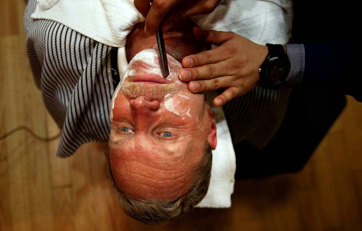 Chris Erskine admires a craftsman’s skill — courtesy of Jose Rojas — at the Art of Shaving in Glendale’s Americana.