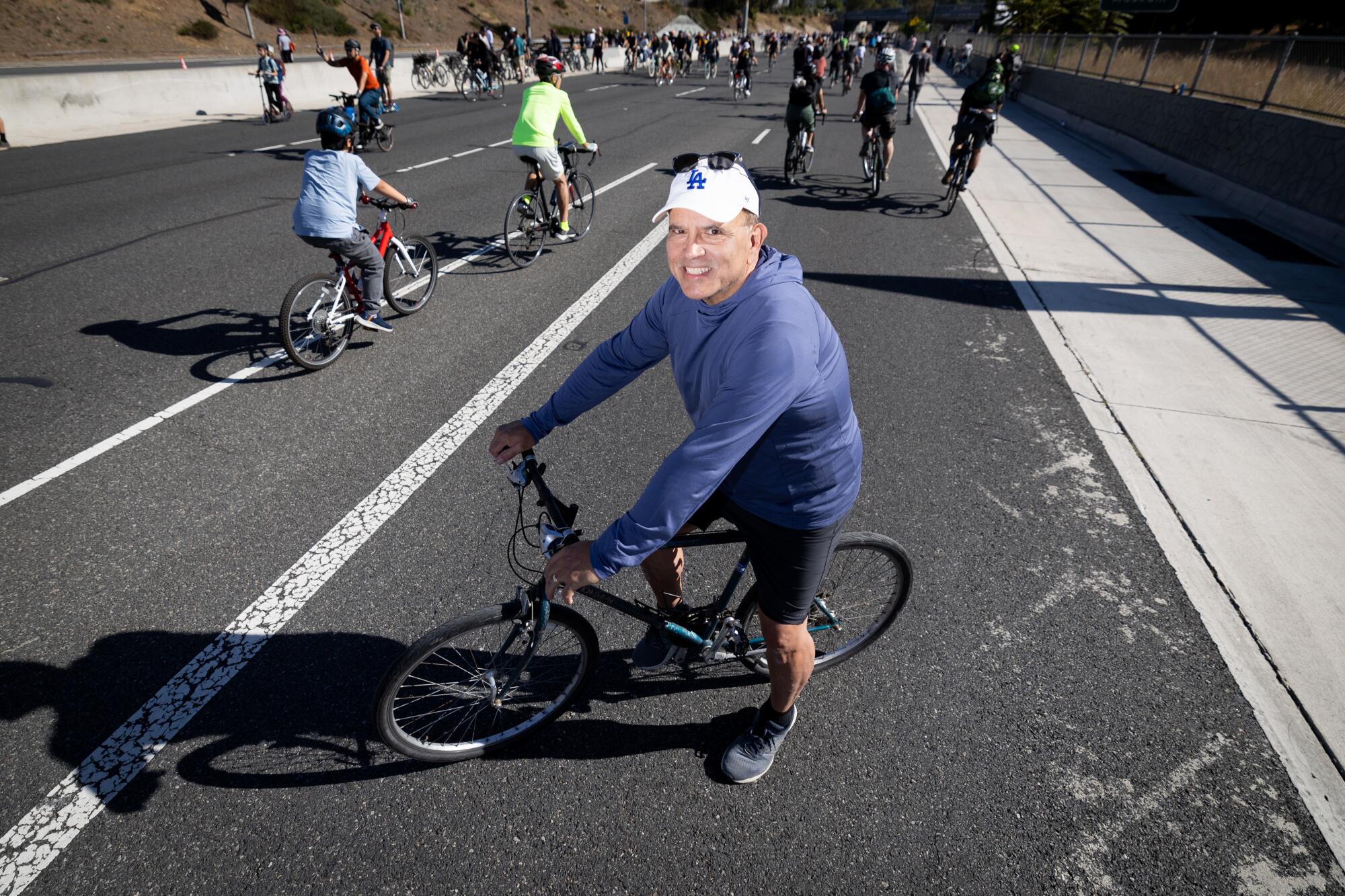 Raul Salinas, 63, of Pasadena, takes a break in the middle of the 110 Freeway