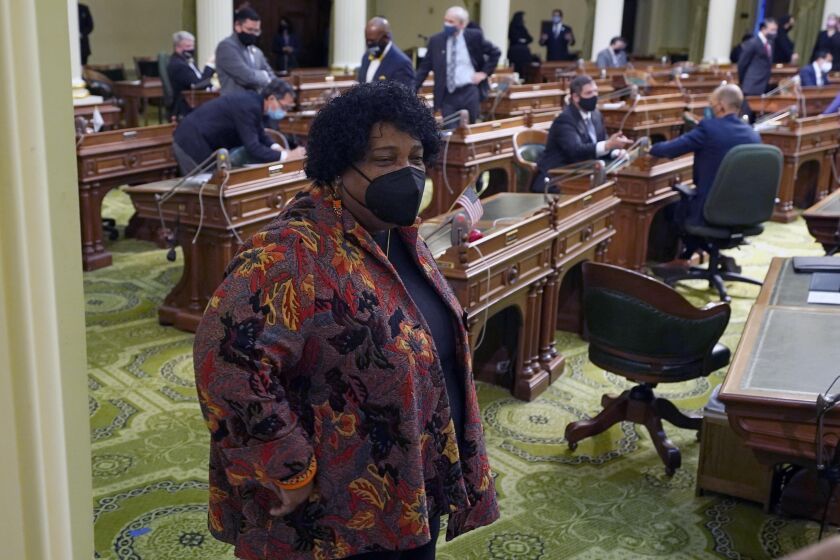 Democratic Assemblywoman Shirley Weber with other Assembly members, unseen, at the Capitol in Sacramento, Calif., Thursday, Jan. 28, 2021. California lawmakers approved Weber, the first black person to become the Secretary of State, filling the position vacated by Alex Padilla who Gov. Gavin Newsom appointed to the U.S. Senate to replace Kamala Harris. (AP Photo/Rich Pedroncelli)