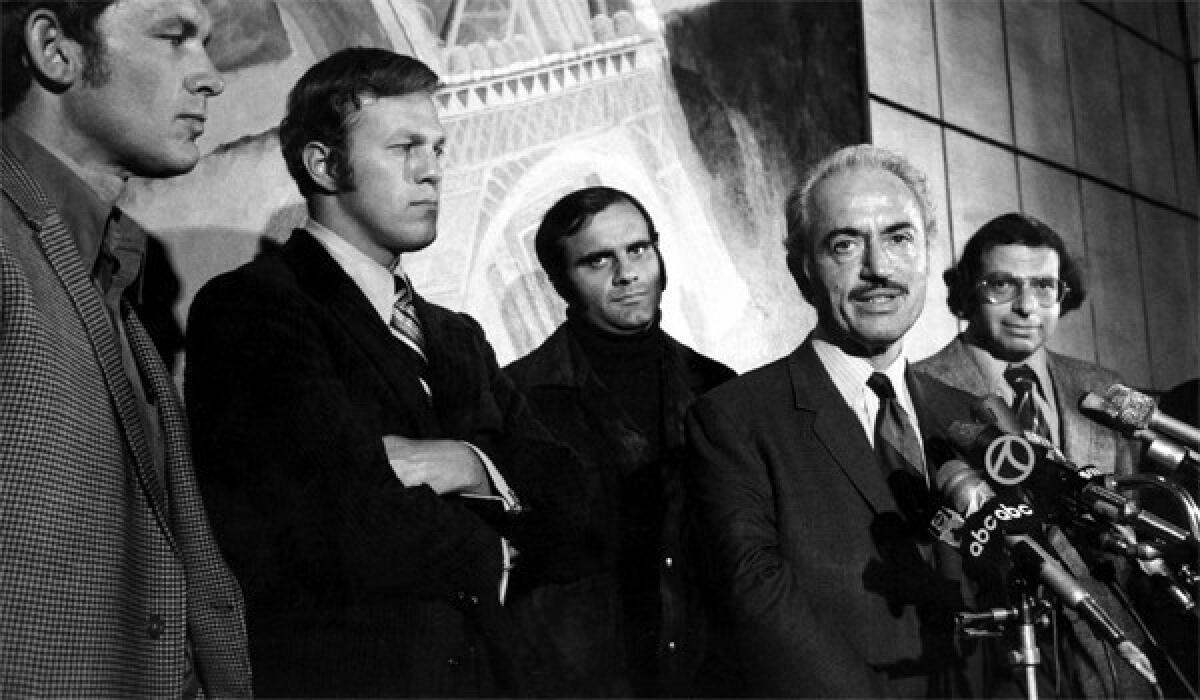 Marvin Miller, second from right, executive director of the Major League Baseball Players Assn., announces an end to the players' strike at a news conference on April 13, 1972. With Miller are players, from left, Gary Peers of the Boston Red Sox, Wes Parker of the Dodgers, and Joe Torre of the St. Louis Cardinals. At right is Dick Moss, assistant counsel for the association.