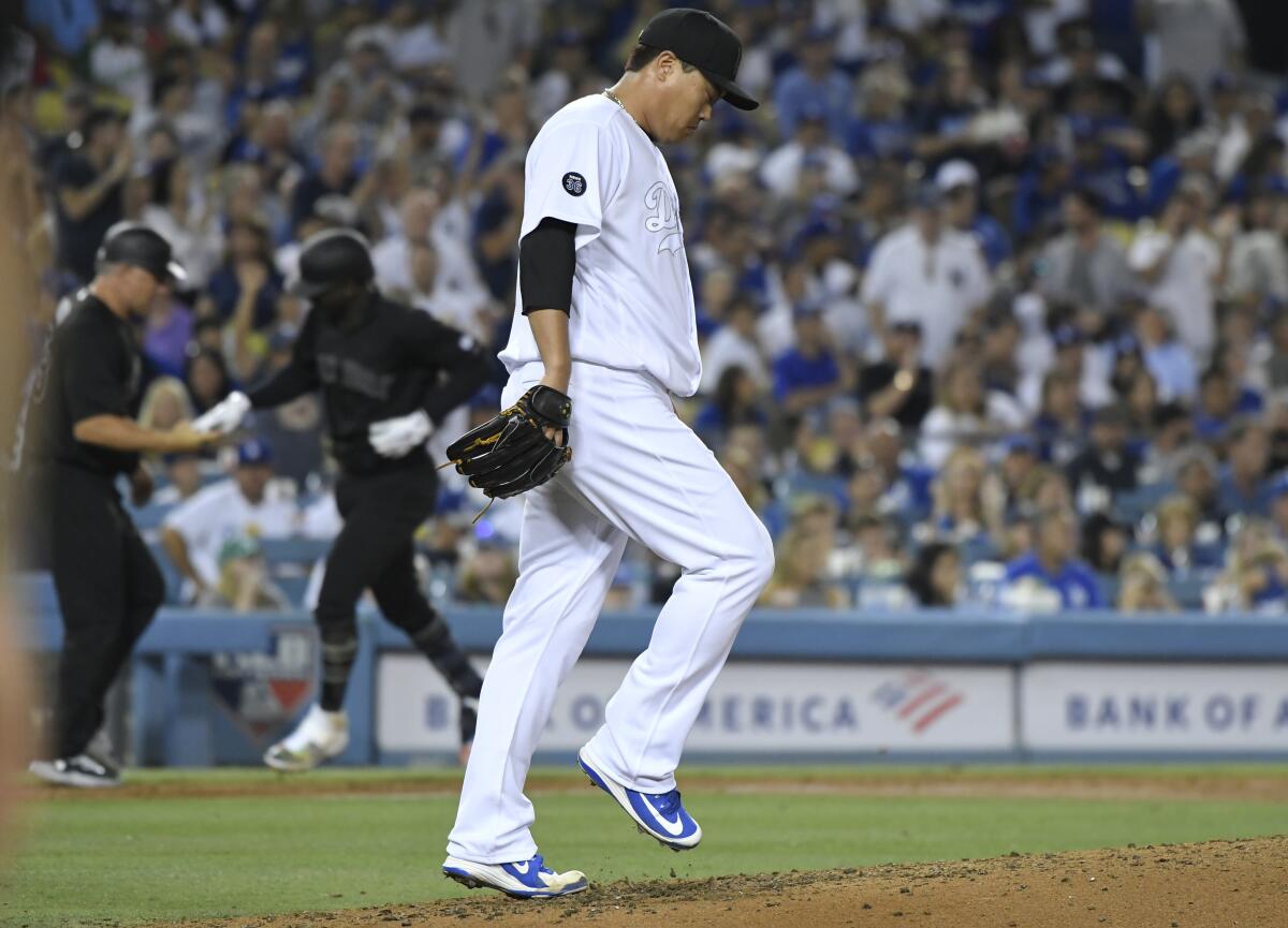 LOS ANGELES, CA - AUGUST 23: Hyun-Jin Ryu #99 of the Los Angeles Dodgers reacts after conceding a grand slam home run to Didi Gregorius #18 of the New York Yankees in the fifth inning at Dodger Stadium on August 23, 2019 in Los Angeles, California. Teams are wearing special color schemed uniforms with players choosing nicknames to display for Players' Weekend. (Photo by John McCoy/Getty Images) ** OUTS - ELSENT, FPG, CM - OUTS * NM, PH, VA if sourced by CT, LA or MoD **