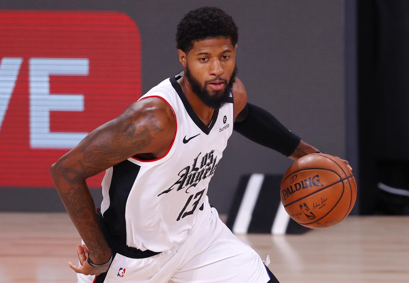 Clippers forward Paul George drives against the Dallas Mavericks during Game 3.