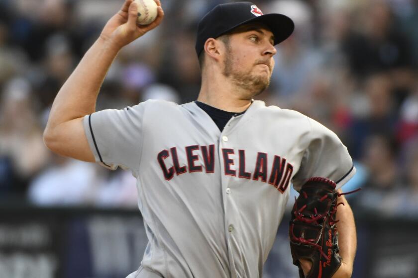 Cleveland Indians starting pitcher Trevor Bauer (47) delivers against the Chicago White Sox during the first inning of a baseball game against the Cleveland Indians on Saturday, Aug. 11, 2018, in Chicago. (AP Photo/Matt Marton)