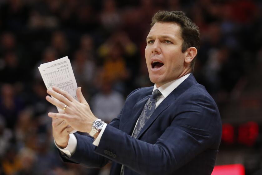 FILE - In this April 3, 2018 file photo, Los Angeles Lakers head coach Luke Walton shouts to his team in the second half during an NBA basketball game against the Utah Jazz in Salt Lake City. Luke Walton began a wellness program for his Lakers coaching staff. Steve Kerr called Steve Clifford in support after each spent significant time away from the sideline because of debilitating headaches among other symptoms. The NBA Coaches Association now provides guidance to its members on everything from diet and exercise to sleep and mental health. (AP Photo/Rick Bowmer, File)