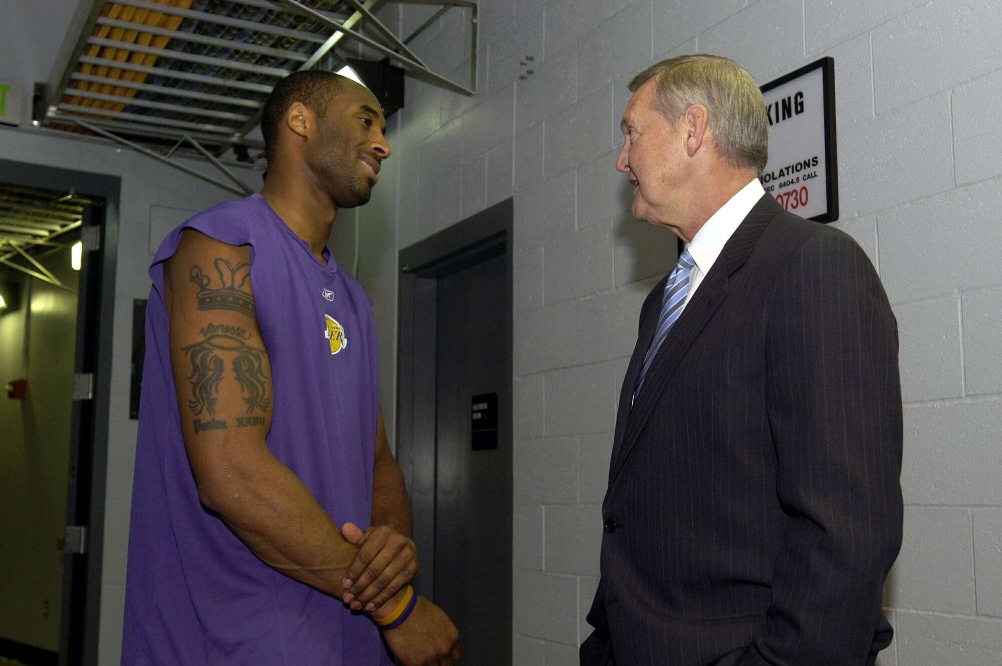 Kobe Bryant talks with Jerry West at a reunion of the 1985 championship Lakers team on April 11, 2005, at Staples Center.
