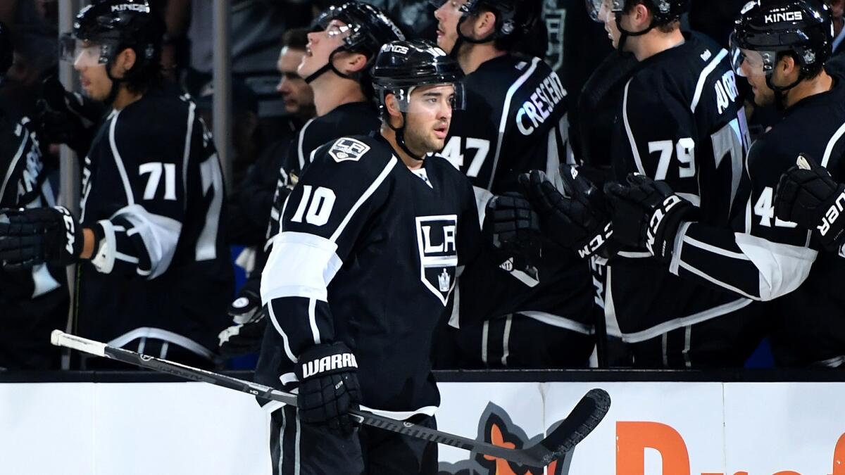 Kings winger Devin Setoguchi is congratulated by teammates after scoring against the Ducks in a preseason game Sept. 28.