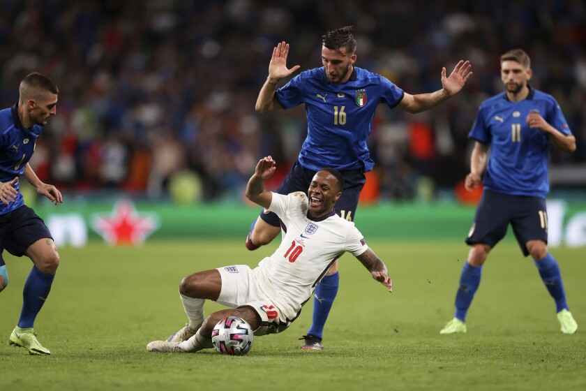 England's Raheem Sterling falls in front of Italy's Bryan Cristante