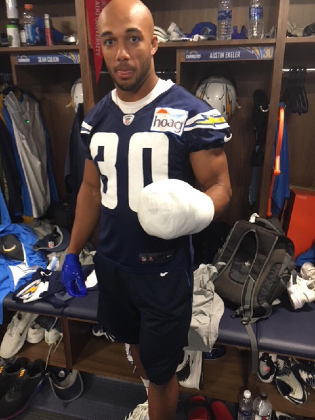 “It feels like I have my hand in a fist,” says Chargers running back Austin Ekeler, shown with his wrapped broken hand.